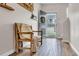 Inviting foyer with hardwood floors, decorative bench, and open view to the home's exterior offers a warm welcome at 4024 Dunkirk Dr, Burlington, NC 27215