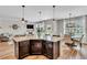 Open-concept kitchen featuring a spacious island with granite countertops and seamless flow to the living area at 4024 Dunkirk Dr, Burlington, NC 27215