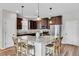 Well-lit kitchen with granite countertops, stainless steel appliances, and a large island with bar seating at 4024 Dunkirk Dr, Burlington, NC 27215
