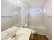 Bright bathroom with a shower-tub combo and a wide mirror over the sink at 4126 Amber Stone Way, Durham, NC 27704