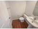 Powder room featuring a pedestal sink and modern fixtures at 4126 Amber Stone Way, Durham, NC 27704