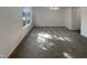 Bright living room with ample space and a large window providing natural light at 4126 Amber Stone Way, Durham, NC 27704