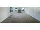 Open living room featuring neutral walls, a fireplace, and ample natural light at 4126 Amber Stone Way, Durham, NC 27704