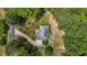 Aerial view of private treed lot with long driveway leading to home at 4225 Old Lewis Farm Rd, Raleigh, NC 27604