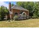 Spacious backyard features a deck and mature trees for outdoor enjoyment at 4225 Old Lewis Farm Rd, Raleigh, NC 27604