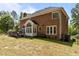 Large fenced yard with brick home and wood deck for entertainment at 4225 Old Lewis Farm Rd, Raleigh, NC 27604