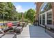 Lovely deck space featuring patio furniture, an umbrella and a stunning view of mature trees at 4225 Old Lewis Farm Rd, Raleigh, NC 27604