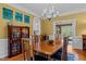 Spacious dining room featuring hardwood floors and a large wooden table at 4225 Old Lewis Farm Rd, Raleigh, NC 27604