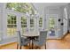 Charming dining area with hardwood floors and large windows offering scenic views at 4225 Old Lewis Farm Rd, Raleigh, NC 27604