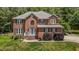 Charming brick home featuring a well-manicured lawn and inviting front entrance at 4225 Old Lewis Farm Rd, Raleigh, NC 27604