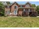 Beautiful brick home with a well-maintained lawn and classic architectural details at 4225 Old Lewis Farm Rd, Raleigh, NC 27604