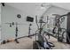 Spacious gym boasts state-of-the-art equipment, neutral carpet, and a vaulted ceiling with a ceiling fan at 4225 Old Lewis Farm Rd, Raleigh, NC 27604