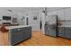 Open concept kitchen with a large island, stainless steel appliances, and ample counter space at 4225 Old Lewis Farm Rd, Raleigh, NC 27604