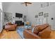 Spacious living room with a fireplace, hardwood floors, and a vaulted ceiling at 4225 Old Lewis Farm Rd, Raleigh, NC 27604