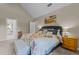 Spacious main bedroom with ensuite bathroom and coordinated furnishings at 4225 Old Lewis Farm Rd, Raleigh, NC 27604