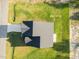 Aerial view of a home with a dark roof and surrounding green lawn at 482 Olivia Crossing Ct, Four Oaks, NC 27524
