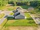 Aerial view of gray homes on large grassy lots with woods in the background at 482 Olivia Crossing Ct, Four Oaks, NC 27524