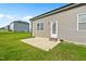 Home exterior features a patio and a spacious lawn at 482 Olivia Crossing Ct, Four Oaks, NC 27524