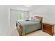Bedroom with wood furnishings, carpet floors, and a window allowing natural light at 482 Olivia Crossing Ct, Four Oaks, NC 27524