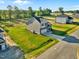 Charming two-story home features a stone facade, attached garage, and a well-maintained lawn at 482 Olivia Crossing Ct, Four Oaks, NC 27524