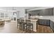 Modern kitchen with granite counters, an island with bar seating, stainless appliances, and open floor plan at 482 Olivia Crossing Ct, Four Oaks, NC 27524