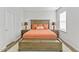 Inviting bedroom with wooden bed and side tables, warm lighting, and neutral decor for a restful retreat at 482 Olivia Crossing Ct, Four Oaks, NC 27524