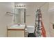 This bathroom offers essential fixtures, including a vanity, toilet, and shower with a curtain at 4907 Hollenden Dr # 106, Raleigh, NC 27616