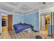 This simple bedroom provides essential space with a bed, closet, and convenient access to the kitchen at 4907 Hollenden Dr # 106, Raleigh, NC 27616
