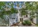 Apartment complex with multiple units, balconies, and a well-maintained landscape at 4907 Hollenden Dr # 106, Raleigh, NC 27616