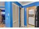 A hallway displays storage and a laundry area, offering functional spaces within the home at 4907 Hollenden Dr # 106, Raleigh, NC 27616