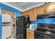 This kitchen includes essential appliances and access to a laundry area for added convenience at 4907 Hollenden Dr # 106, Raleigh, NC 27616