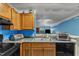 A well-equipped kitchen features essential appliances and connects to another room for easy access at 4907 Hollenden Dr # 106, Raleigh, NC 27616