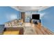 Spacious living room featuring a large sofa, entertainment center, and natural light at 4907 Hollenden Dr # 106, Raleigh, NC 27616