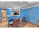 Open floor plan with breakfast bar, wood floors and space for a dining table at 4907 Hollenden Dr # 106, Raleigh, NC 27616