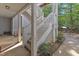 Exterior staircase of an apartment building with latticed railings, and green foliage at 4907 Hollenden Dr # 106, Raleigh, NC 27616