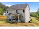 Home exterior featuring a covered patio, backyard and view of the lawn and trees at 5 Cinnamon Teal Way, Youngsville, NC 27596