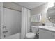 Clean bathroom featuring a shower-tub combination and a bright vanity area at 5 Cinnamon Teal Way, Youngsville, NC 27596