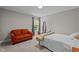 Cozy bedroom featuring a comfortable bed and a sitting area near the window at 5 Cinnamon Teal Way, Youngsville, NC 27596