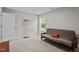 Bedroom with carpet, display case, and window providing natural light at 5 Cinnamon Teal Way, Youngsville, NC 27596