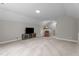 Large bonus room with carpet flooring, a TV, and a comfortable chair at 5 Cinnamon Teal Way, Youngsville, NC 27596