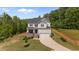 Charming two-story home with a two-car garage, landscaped yard, and a welcoming front porch at 5 Cinnamon Teal Way, Youngsville, NC 27596