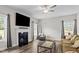 Inviting living room features a fireplace, hardwood floors, and a ceiling fan at 5 Cinnamon Teal Way, Youngsville, NC 27596