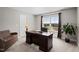 Home office featuring a large desk and a comfortable sitting area at 5 Cinnamon Teal Way, Youngsville, NC 27596