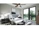 Serene main bedroom with large window, ceiling fan, and modern decor creating a peaceful retreat at 512 Gordon St # 901, Durham, NC 27701