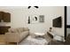 Cozy living room with soft neutral colors, sofa, area rug, and wall mounted tv at 512 Gordon Street # 304, Durham, NC 27701