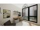 Modern office space features neutral tones, sleek desk, decorative lighting and window at 512 Gordon Street # 304, Durham, NC 27701
