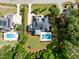 Overhead view of an estate featuring a private pool, meticulously maintained landscaping, and neighborhood surroundings at 5125 Avalaire Oaks Dr, Raleigh, NC 27614