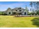 Well-manicured backyard with inground pool, ample green space, lush landscaping, and patio for outdoor enjoyment at 5125 Avalaire Oaks Dr, Raleigh, NC 27614