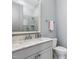 Charming bathroom featuring a modern vanity with marble countertop and glass-enclosed shower at 5125 Avalaire Oaks Dr, Raleigh, NC 27614