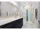 Sleek bathroom features a glass-enclosed shower, granite vanity, and modern fixtures at 5125 Avalaire Oaks Dr, Raleigh, NC 27614